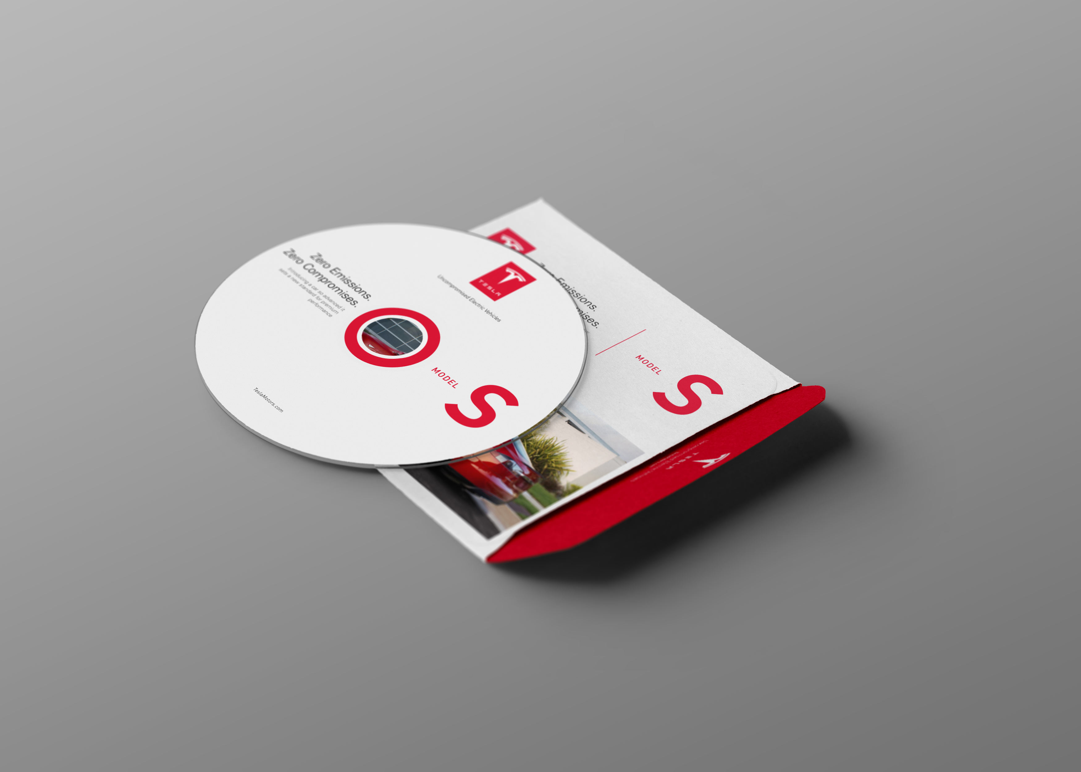 Tesla Model S catalog disc and branded sleeve designed as part of the printed editorial system.