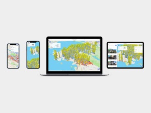 Early TopHap application shown across mobile, tablet, and desktop devices, demonstrating responsive map-based property search and 3D real estate data visualization.